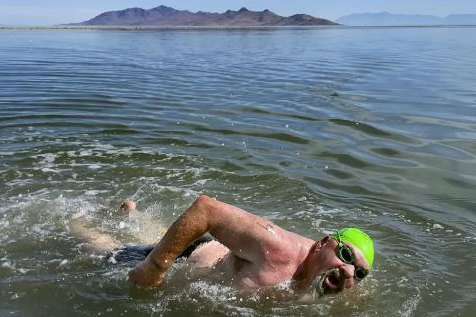 (Laura Seitz | Deseret News) Lane Henderson, of Riverton, competes in a 1-mile open swim competition at Great Salt Lake State Park in Magna on Saturday, June 11, 2022