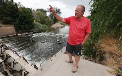 Brad Blanch looks over a dam on the Weber River in Weber County on Wednesday, July 26, 2023. Blanch is a West Weber resident who wants to lease several hundred acre-feet of water to benefit the Great Salt Lake. Jeffrey D. Allred, Deseret News