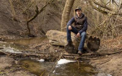 Will Munger, a doctoral student in Utah State University in the Department of Environment and Society, poses for a photo along Emigration Creek in Wasatch Hollow Preserve in Salt Lake City on Friday, April 15, 2022.Scott G Winterton, Deseret News