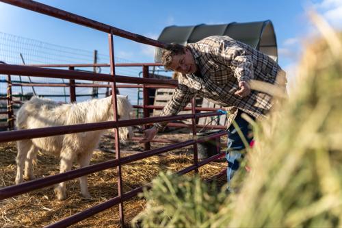 Tooele County resident Chris Eddington, whose backyard borders the recently approved Tooele Valley inland port project, pets his pony on February 27, 2024. (Photo credit: Xiangyao “Axe” Tang)