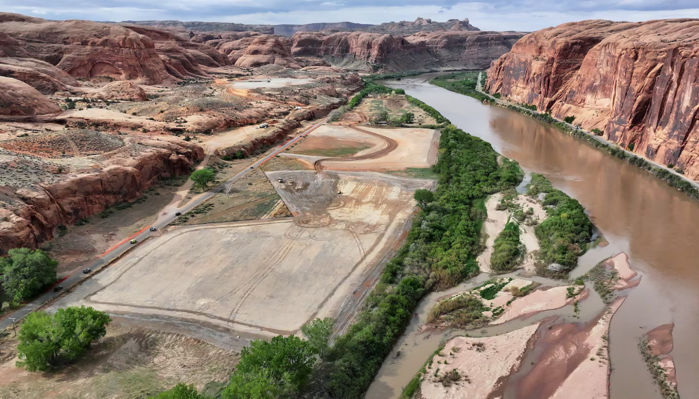 The 180-acre Kane Creek development site, which is in a floodplain, is pictured along the Colorado River near Moab on Friday, April 26, 2024. Developers plan to build around 580 residential and commercial units. There is only one road in and out. | Kristin Murphy, Deseret News