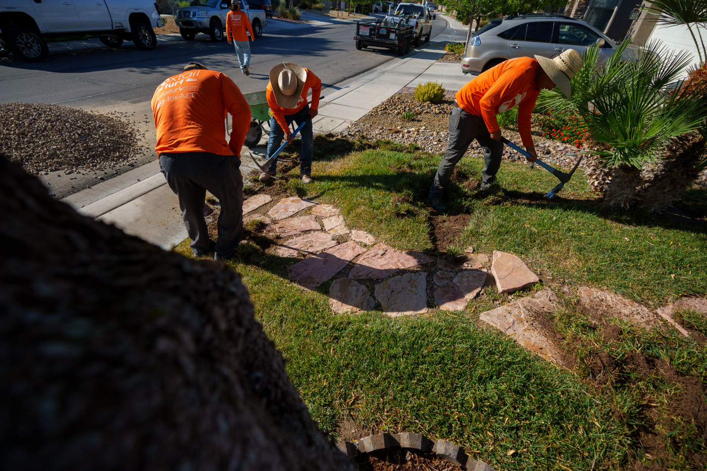 (Trent Nelson | The Salt Lake Tribune) Workers with Foxtail Turf remove the grass from Patricia Council's North Las Vegas yard, replacing it with artificial turf on Thursday, Sept. 29, 2022.