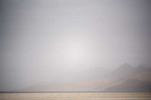 (Trent Nelson | The Salt Lake Tribune) Dust obscures Antelope Island and the Great Salt Lake on Saturday, June 18, 2022.