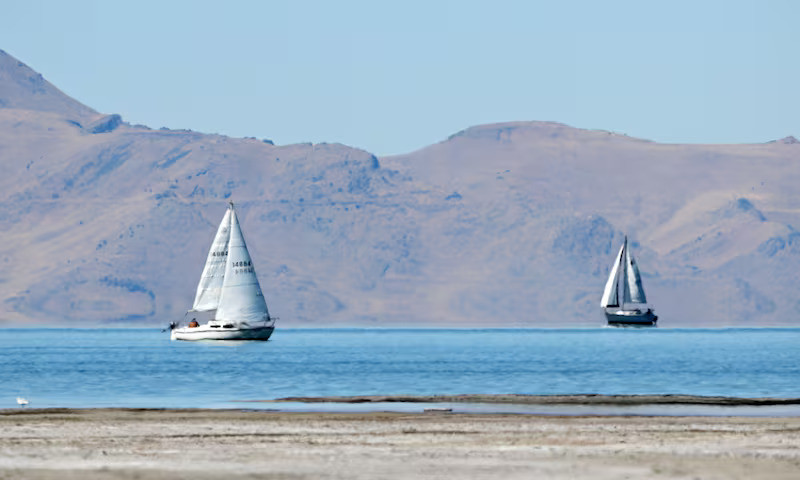 Two sailboats move across the water at the Great Salt Lake, near Magna, on Sept. 24, 2024. Scott G Winterton, Deseret News