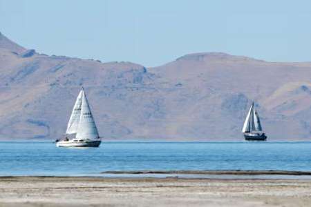 Two sailboats move across the water at the Great Salt Lake, near Magna, on Sept. 24, 2024. Scott G Winterton, Deseret News