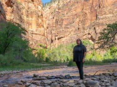 Autumn Gillard stands on the banks of the Virgin River in Zion National Park, Utah, Oct. 16, 2024. Photo by Sheldon Demke, St. George News 