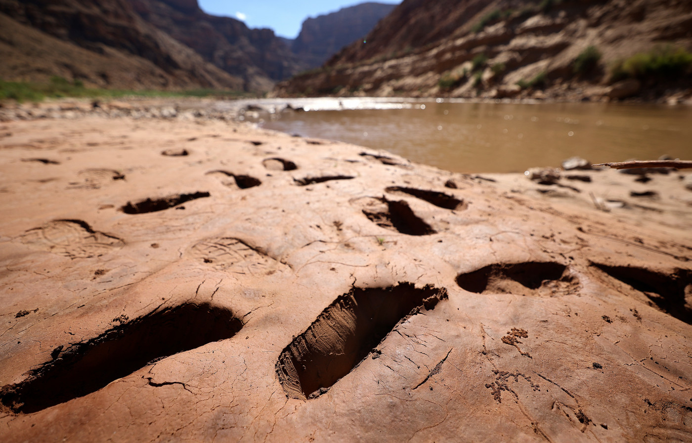 Footprints where people have sunk into mud are pictured above Gypsum Canyon rapid in Cataract Canyon on the banks of the Colorado River on Friday, Sept. 20, 2024. Kristin Murphy, Deseret News