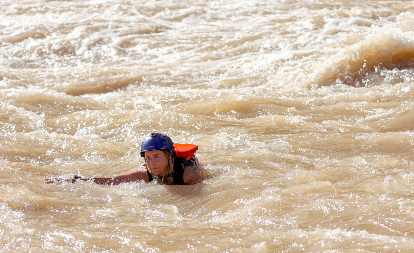 Deseret News reporter Emma Pitts swims in the Colorado River by Gypsum Canyon rapid in Cataract Canyon on Friday, Sept. 20, 2024. Gypsum is one of the rapids that has recently returned, after being buried under Lake Powell for years. Kristin Murphy, Deseret News 