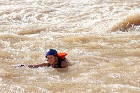 Deseret News reporter Emma Pitts swims in the Colorado River by Gypsum Canyon rapid in Cataract Canyon on Friday, Sept. 20, 2024. Gypsum is one of the rapids that has recently returned, after being buried under Lake Powell for years. Kristin Murphy, Deseret News 