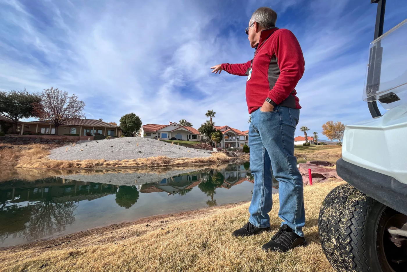 Doug Bennett of the Washington County Water Conservancy District points out part of Sunbrook Golf Course that has been converted from grass to desert landscaping, Dec. 3, 2024. Photo by David Condos/KUER