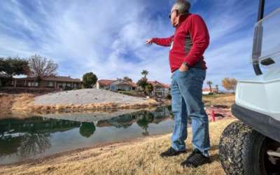 Doug Bennett of the Washington County Water Conservancy District points out part of Sunbrook Golf Course that has been converted from grass to desert landscaping, Dec. 3, 2024. Photo by David Condos/KUER