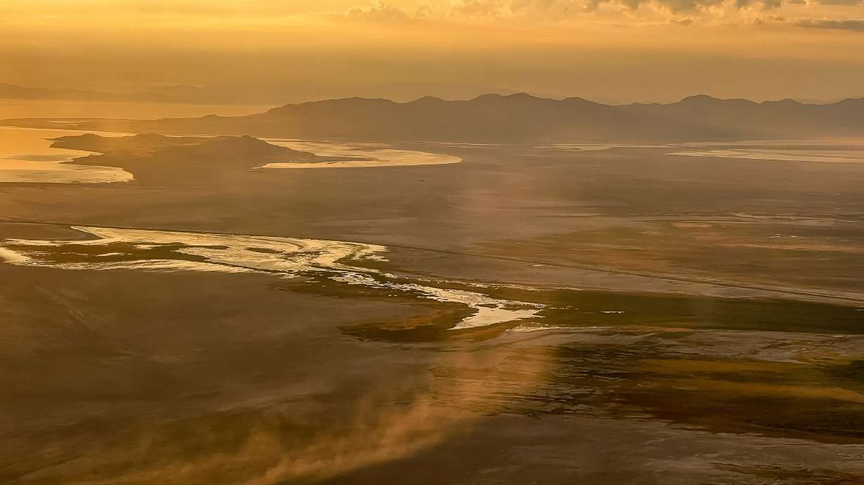 Dust blows across the dry lakebed of the Great Salt Lake on Aug. 12, 2022. The leader of a group advocating for air quality monitors to study Great Salt Lake dust says he's disappointed the project may miss out on funding in this year's budget. (Spenser Heaps, Deseret News) 