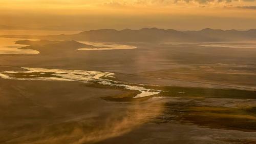 Dust blows across the dry lakebed of the Great Salt Lake on Aug. 12, 2022. The leader of a group advocating for air quality monitors to study Great Salt Lake dust says he's disappointed the project may miss out on funding in this year's budget. (Spenser Heaps, Deseret News) 