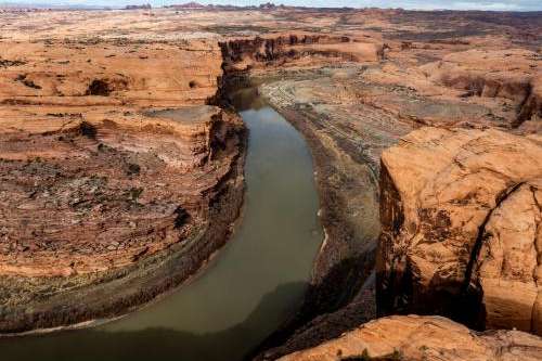 The Colorado River is pictured near Moab on Sunday, Feb. 18, 2024. (Photo by Spenser Heaps for Utah News Dispatch)