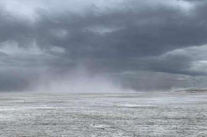 Dust flies off the Great Salt Lake on Sunday. Environmental groups warn that despite the increase this spring, the lake is still prone to dust storms. (Carmen Valdez/Healthy Environment Alliance of Utah)