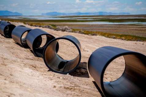 (Trent Nelson | The Salt Lake Tribune) Construction of North Davis Sewer District's new pipeline along the Antelope Island Causeway on Tuesday, May 31, 2022. The pipeline will discharge treated water into the Great Salt Lake west of Antelope Island, instead of into Farmington Bay.